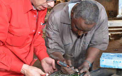 Technicians repair the broken component