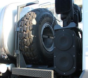 The spare wheel is placed right hand side of the truck. It can be comfortable operated with a small hoist.