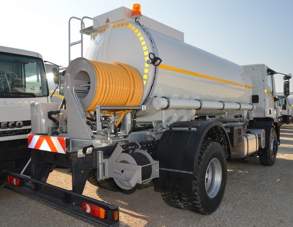 Rear view with high pressure pump, control panel and two hose reels